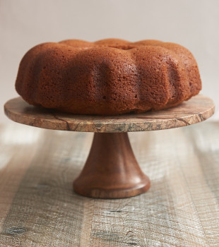 Amaretto Cake on a wood and marble cake stand