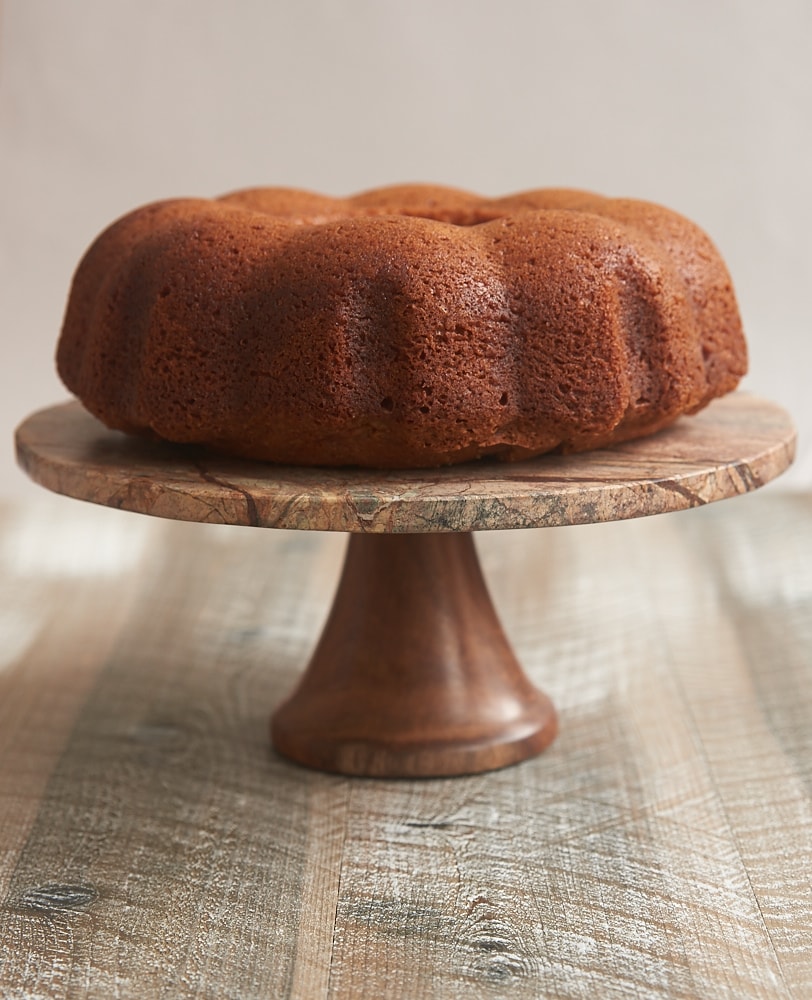 Amaretto Cake on a wood and marble cake stand