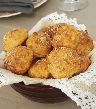 Gougeres (Cheese Puffs) in a napkin-lined bowl.