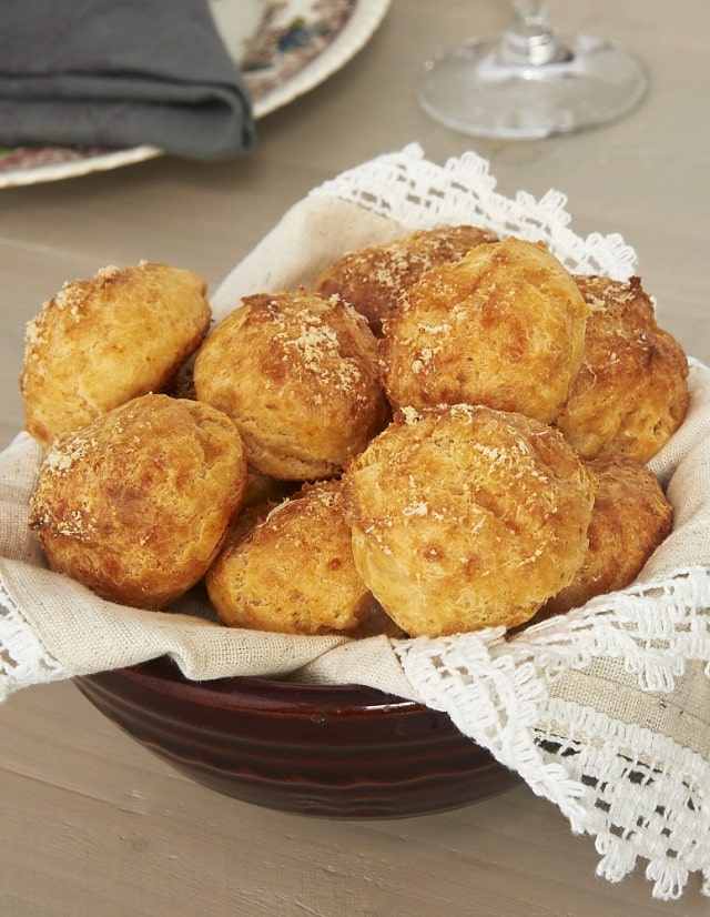 Gougeres (Cheese Puffs) in a napkin-lined bowl.