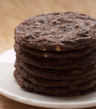 Chewy Chocolate Cookies stacked on a white plate