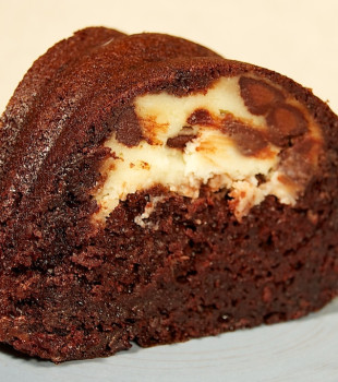 A slice of marbled chocolate bundt cake on a plate