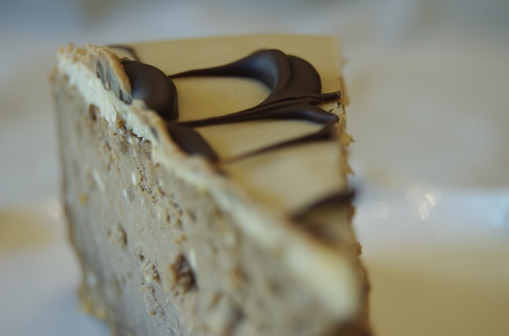 Close-up of a slice of Peanut Butter and Chocolate Cheesecake on a plate