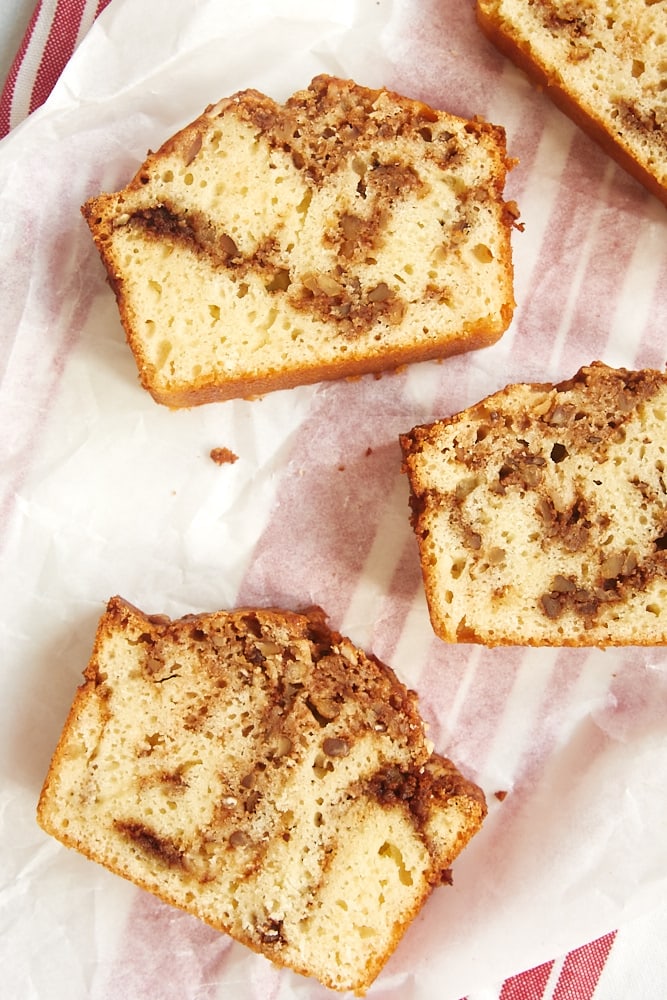 Cinnamon Swirl Bread slices on white parchment paper