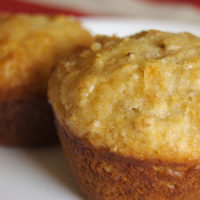 Easy and quick peach pecan muffins arranged on a plate.