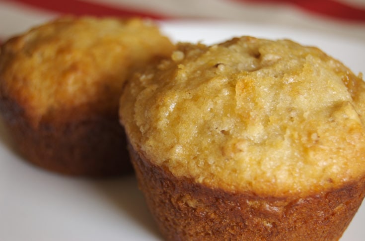 Easy and quick peach pecan muffins arranged on a plate.