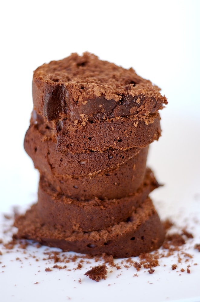 slices of Chocolate Cream Cheese Pound Cake stacked on a white surface