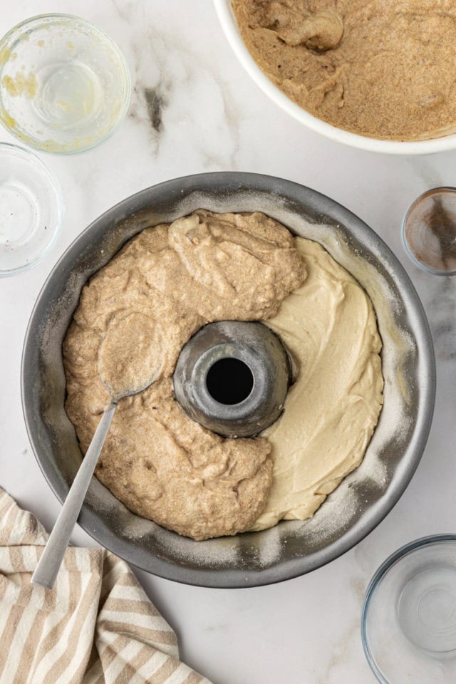 Adding cinnamon batter to cinnamon crown cake in pan