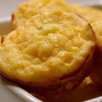 Bite sized corn bread on a serving plate.