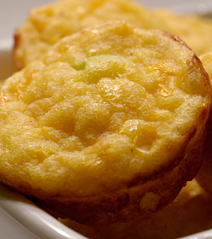 Bite sized corn bread on a serving plate.
