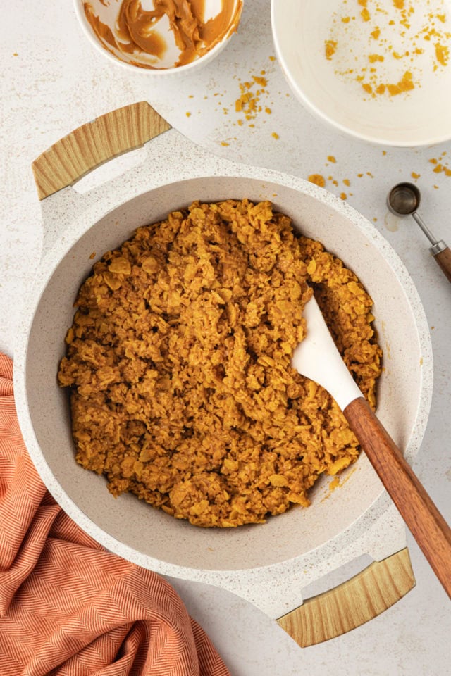 Overhead view of peanut butter cornflake bar mixture in bowl