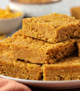 5-ingredient peanut butter cornflake bars stacked on plate