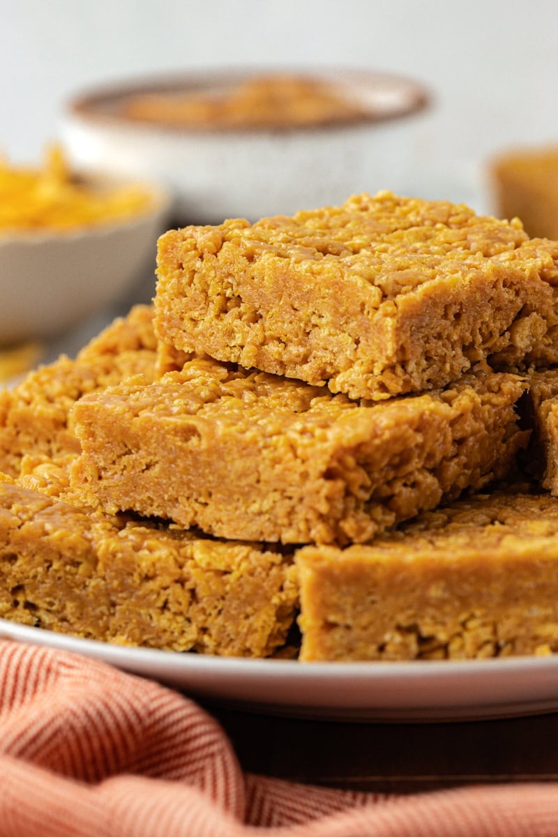 5-ingredient peanut butter cornflake bars stacked on plate