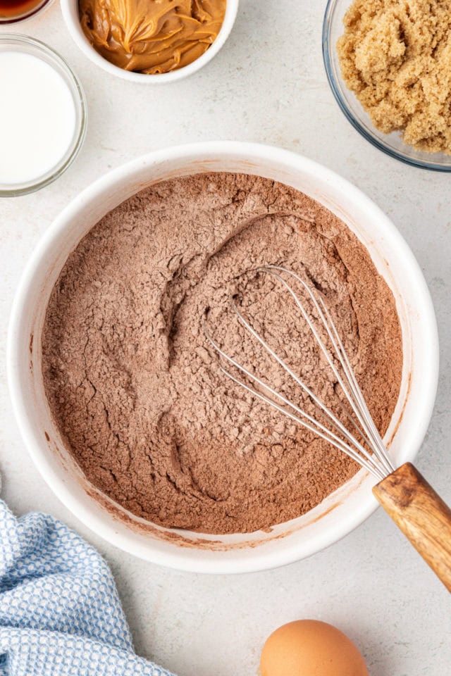 Dry ingredients for peanut butter-filled chocolate cookies in mixing bowl