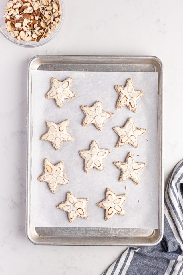 Overhead view of zimtsterne on baking sheet