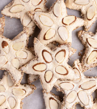 Overhead view of zimtsterne on baking sheet