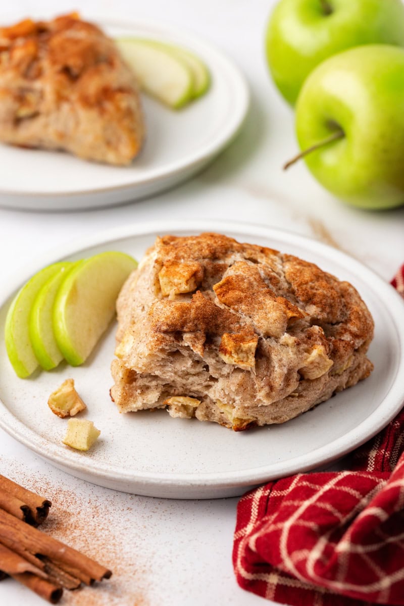 Tender apple cinnamon scones on plate with apples