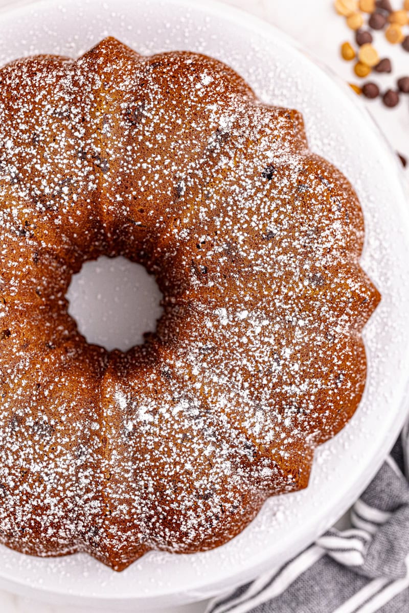 Overhead view of whole peanut butter pound cake on cake stand