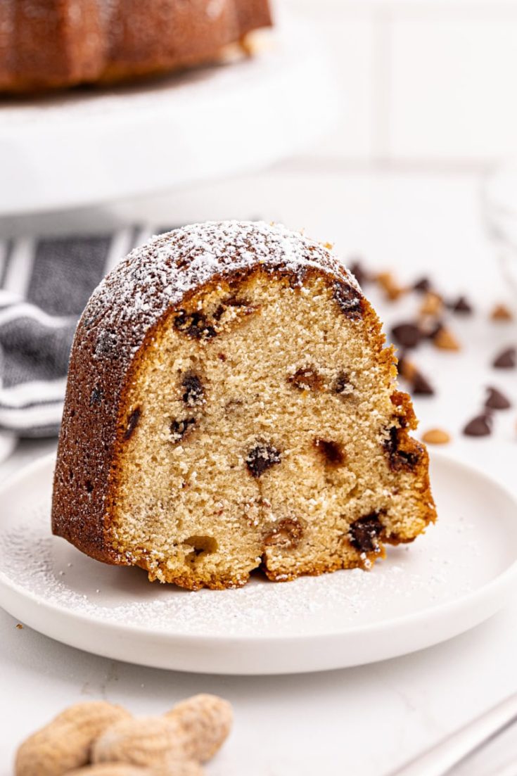 Slice of peanut butter pound cake standing upright on plate