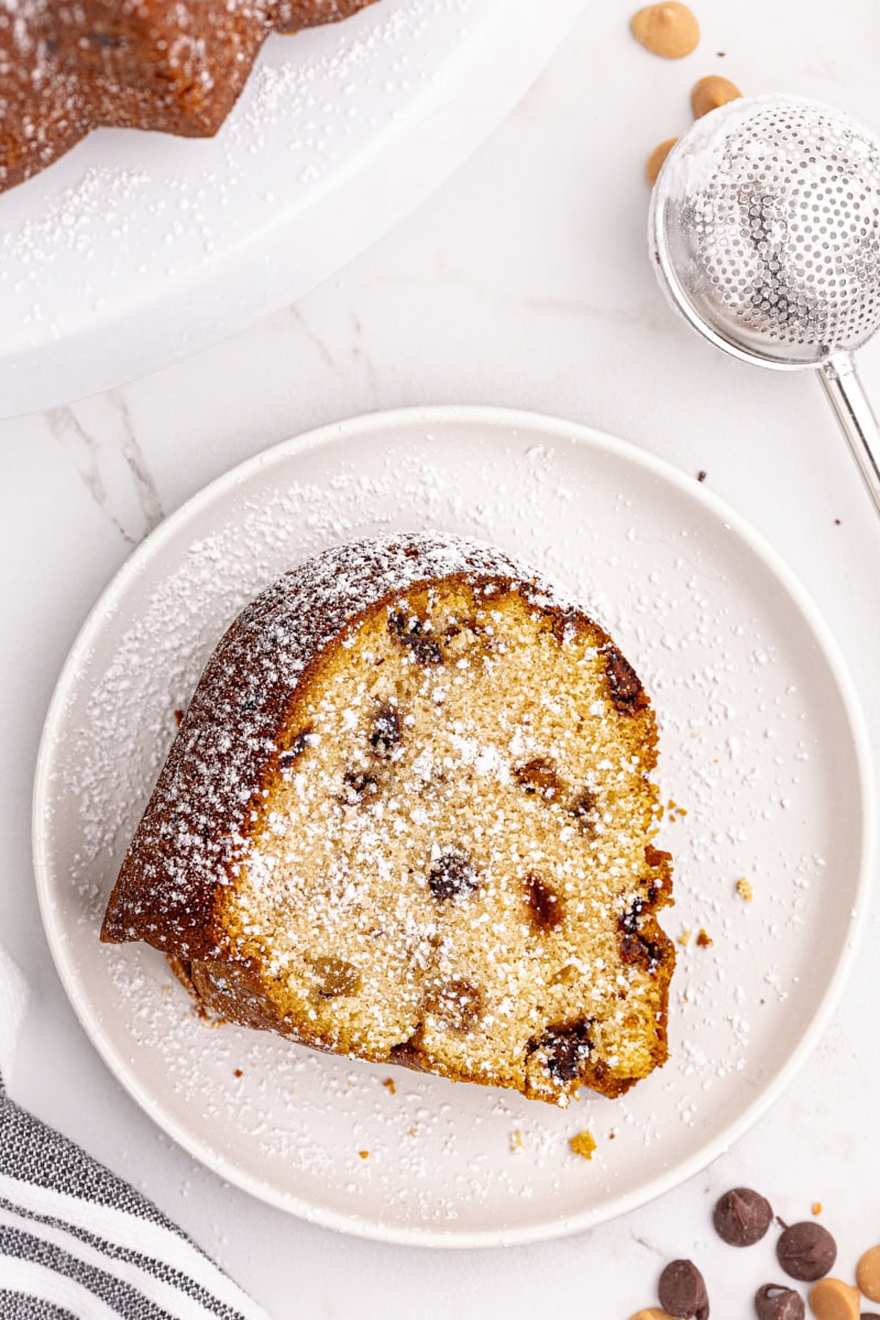 Slice of peanut butter pound cake dusted with powdered sugar