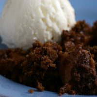 Pear and chocolate crumble with ice cream.