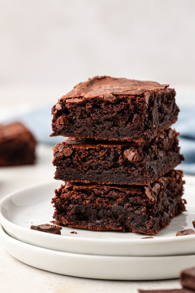 3 double chocolate brownies stacked on plate