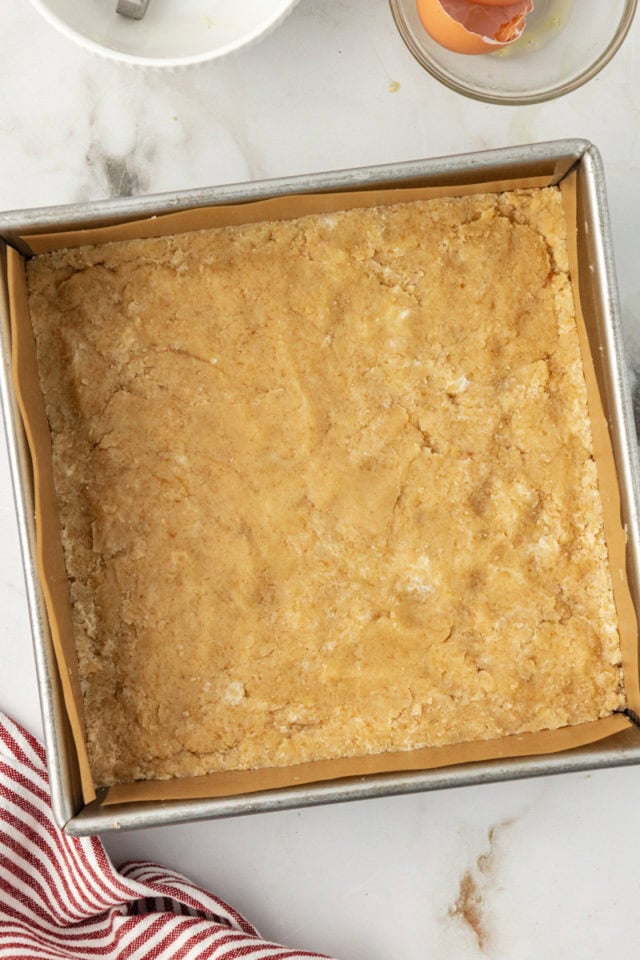 Overhead view of crust for raspberry crumble bars