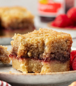 Side view of raspberry crumble bar to show layers