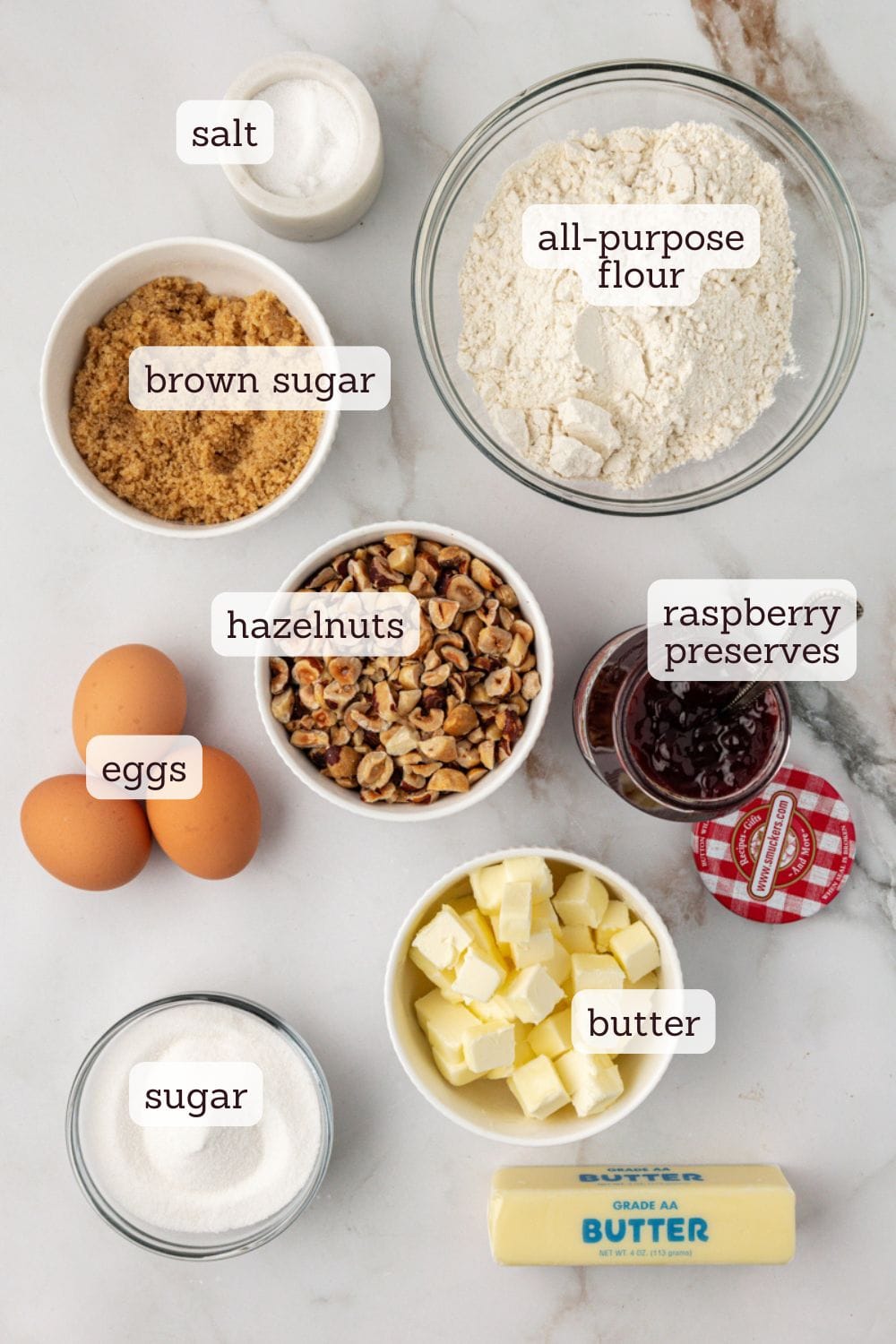 Overhead view of ingredients for raspberry crumble bars with labels