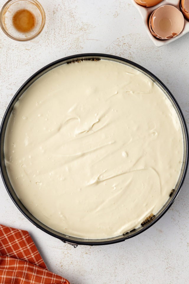 Overhead view of unbaked cheesecake in pan