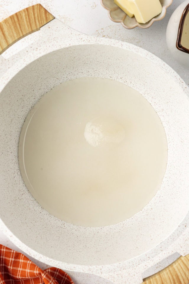 Overhead view of butter and sugar in pan