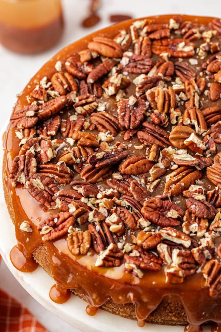 Whole salted caramel cheesecake on cake stand