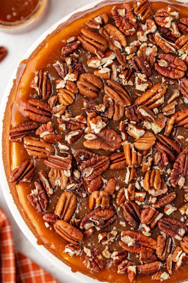 Overhead view of salted caramel cheesecake with pecans