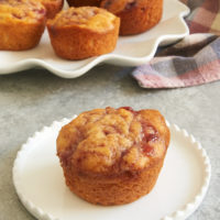 Raspberry cream cheese buns on a white plate.