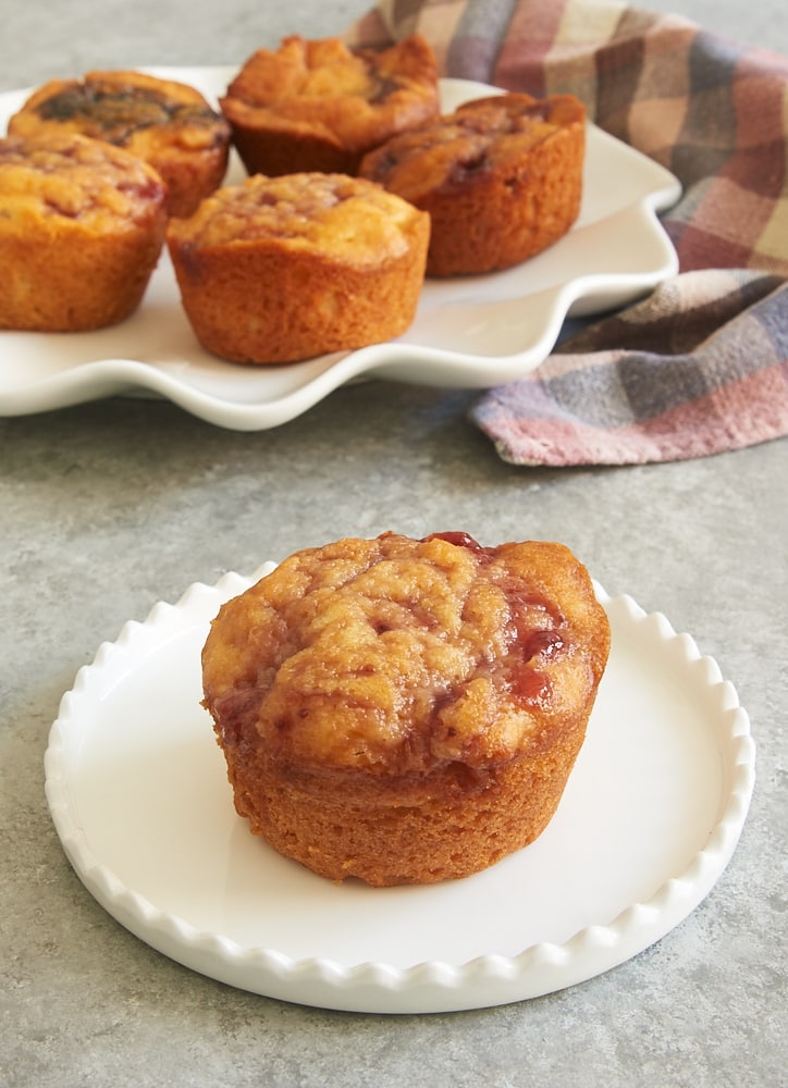 Raspberry cream cheese buns on a white plate.