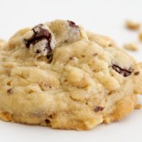 Granola Cookies with Chocolate and Roasted Almonds on a white surface.