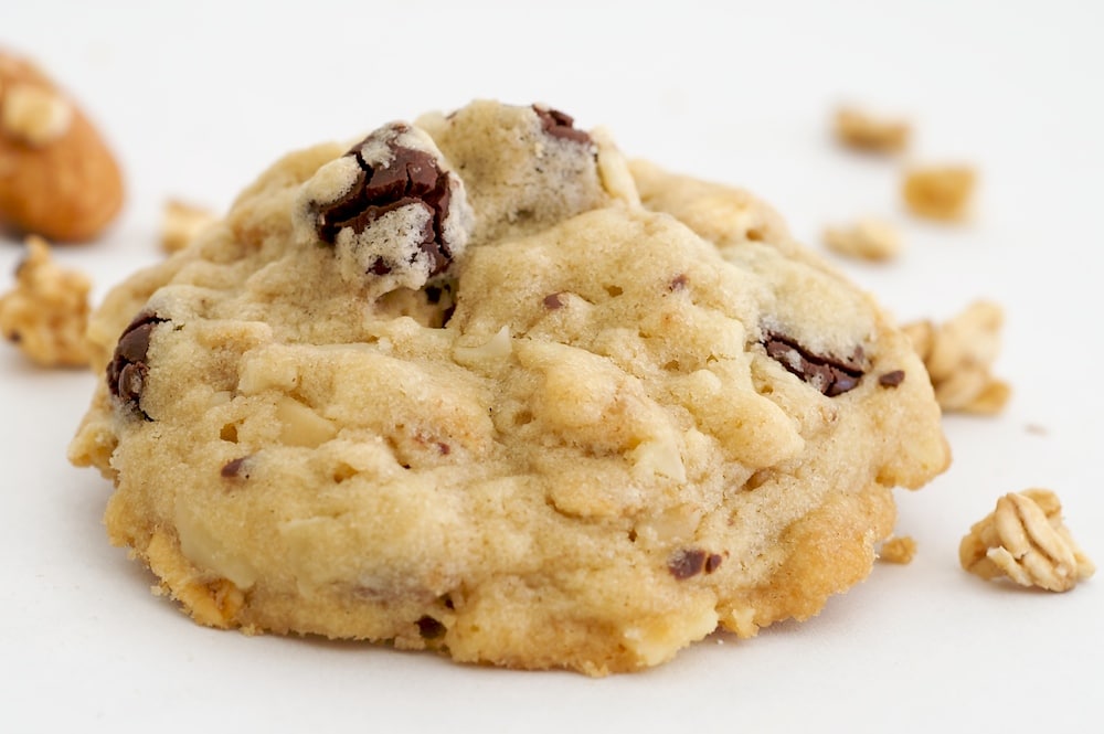 Granola Cookies with Chocolate and Roasted Almonds on a white surface