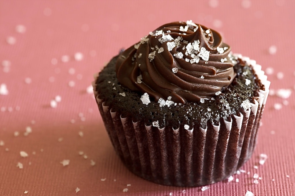 Chocolate Salted Caramel Mini Cupcake on a pink surface