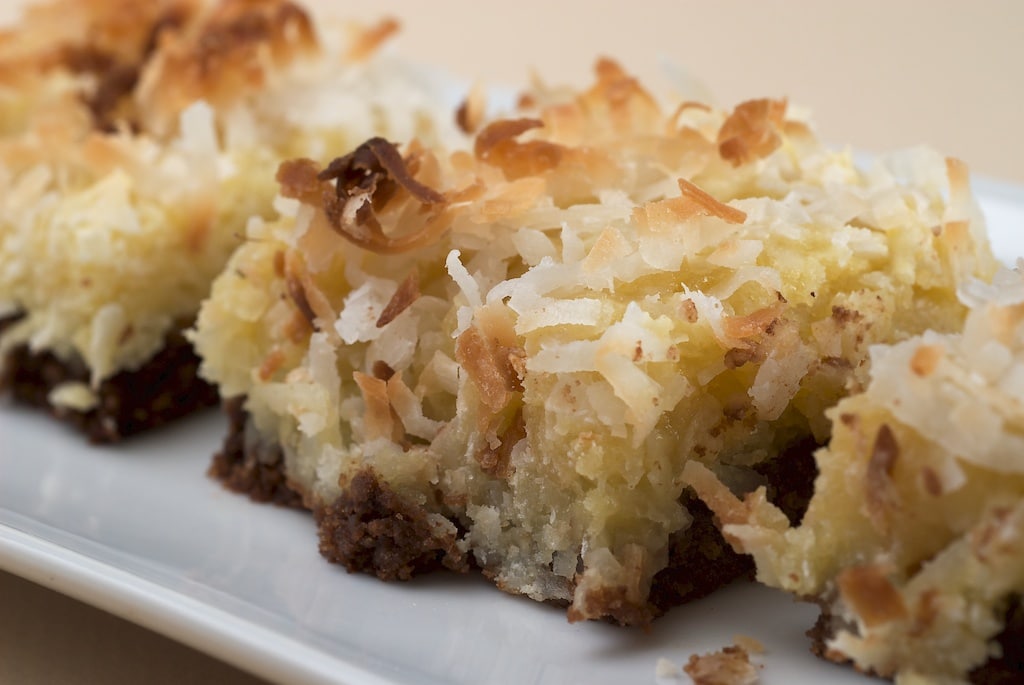 Black-Bottom Coconut Bars feature a wonderfully, gooey, coconut-y mixture on top of a thin brownie. - Bake or Break