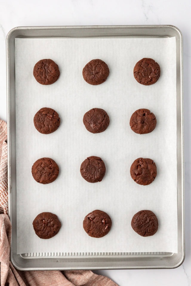 Overhead view of chocolate espresso cookies on parchment-lined baking sheet