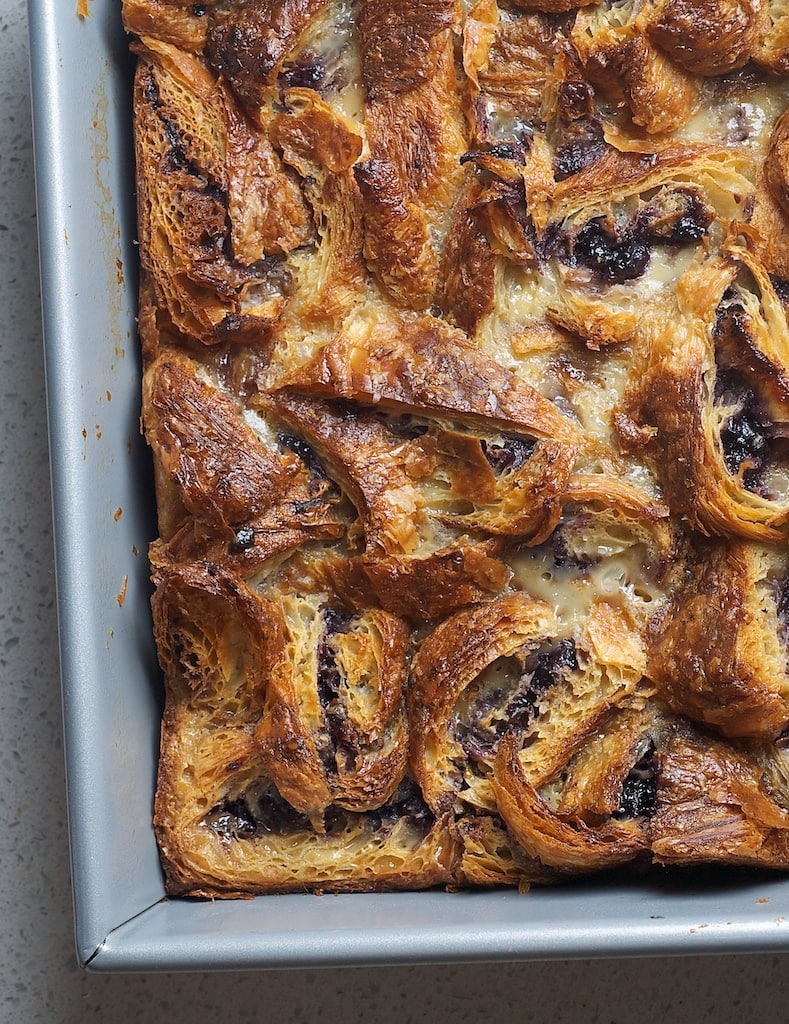 Blueberry Croissant Bread Pudding in a metal baking pan.