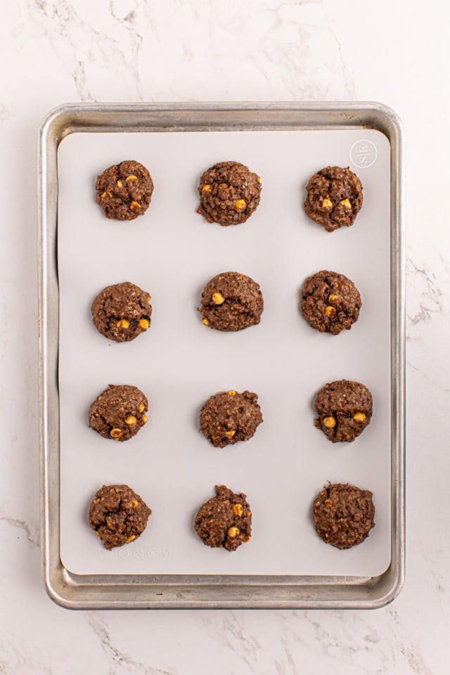 Overhead view of chocolate butterscotch cookies on baking sheet