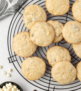 Overhead view of black and white chocolate chip cookies on wire rack