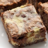 Closeup of hazelnut cream cheese brownies on plate