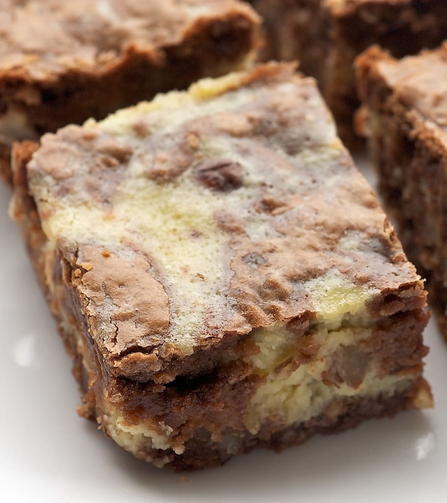 Closeup of hazelnut cream cheese brownies on plate