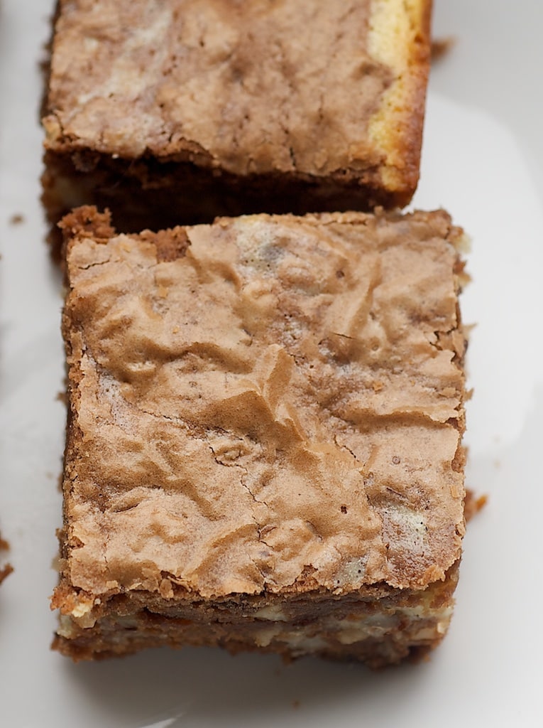 Cut hazelnut cream cheese brownies on plate