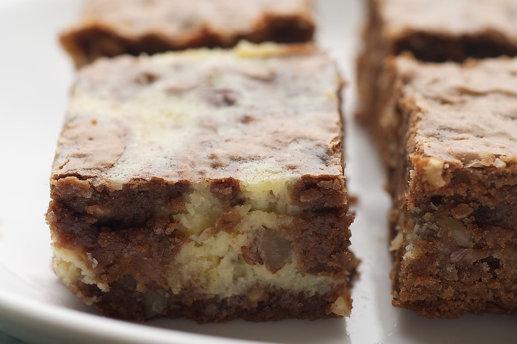 Side view closeup of hazelnut cream cheese brownies