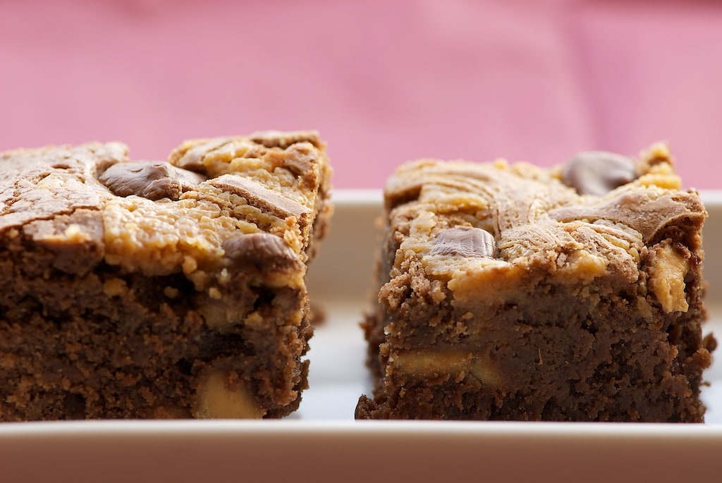 Peanut Butter Brownies are rich brownies swirled with peanut butter and dotted with mini peanut butter cups. Absolutely delicious! - Bake or Break