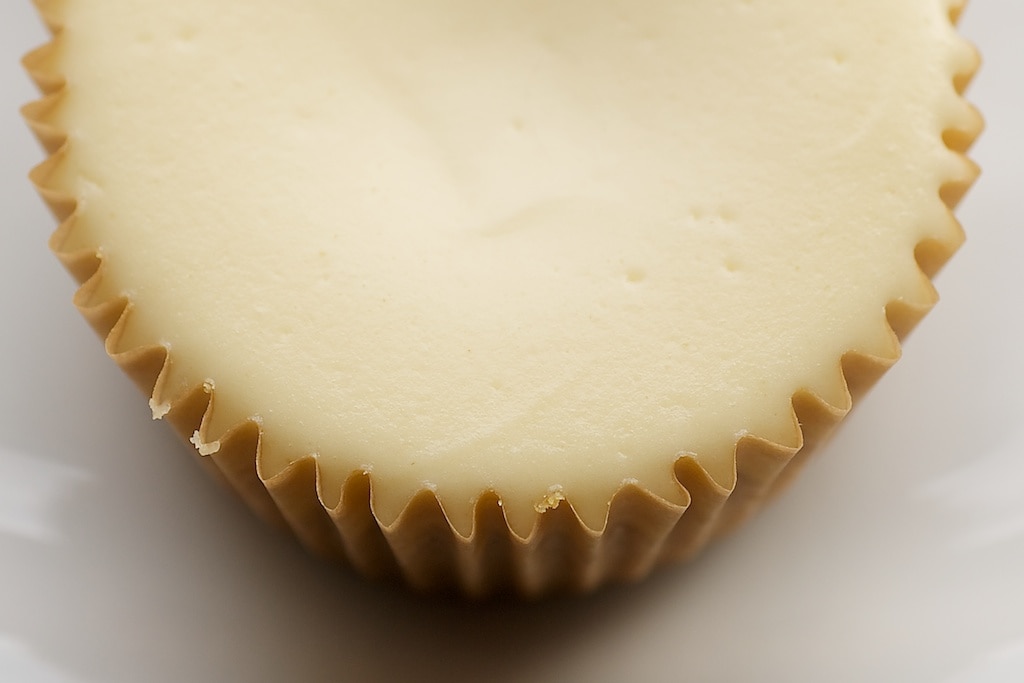 Peanut Butter Cheesecake Minis feature a peanut butter cup surprise inside miniature cheesecakes.