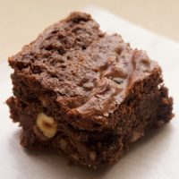 Kitchen sink brownie on parchment paper.